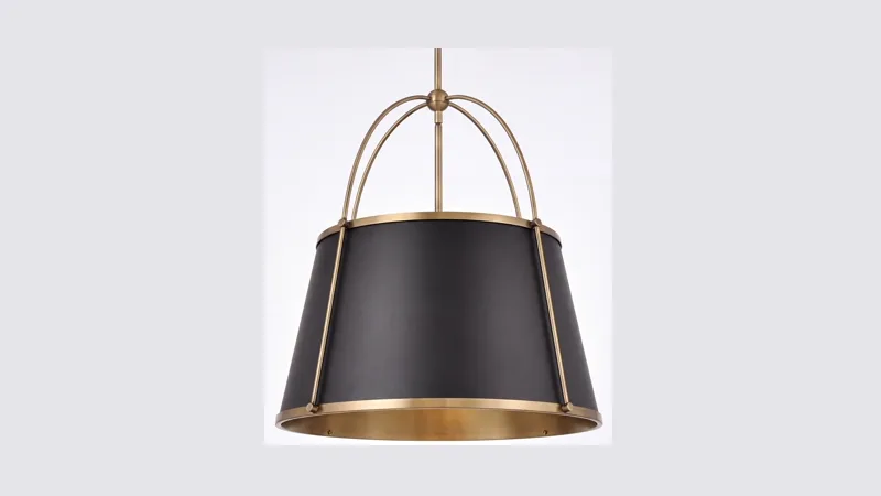 Pendant light with a black tapered shade and an aged brass frame and rim.
